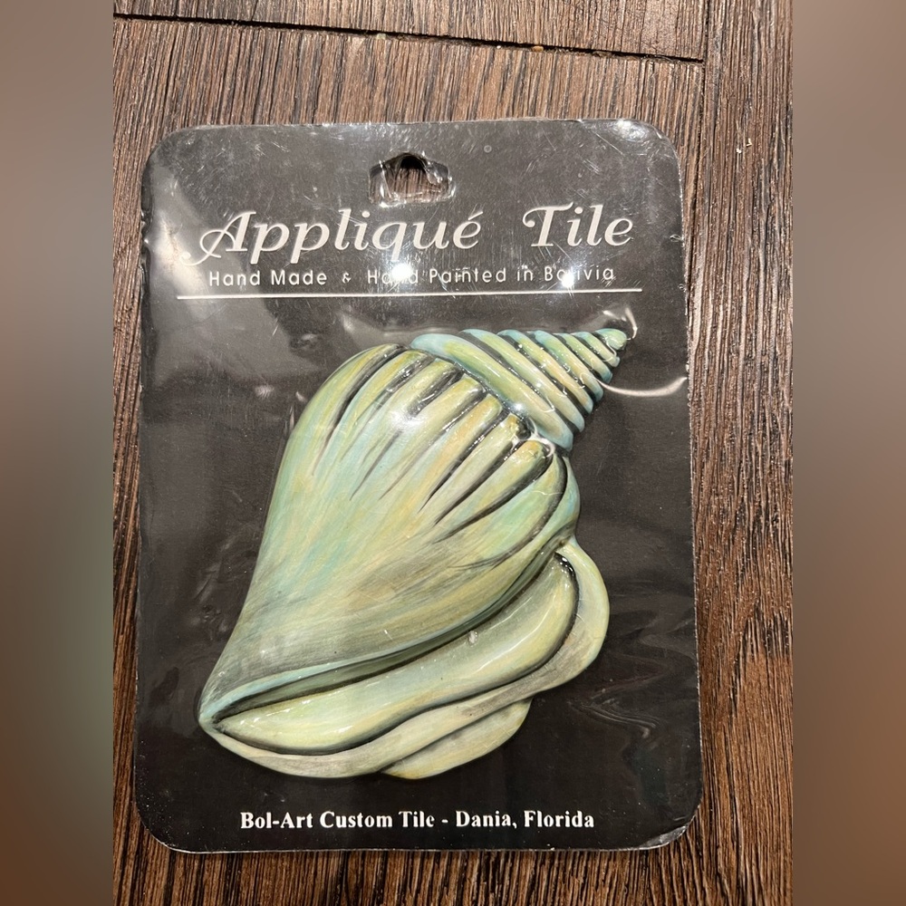 New in package hand made Conch shell appliqué tile. Bol-Art custom tile